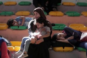 Palestinian children sleep as they and their family wait for their turn to enter the Rafah border crossing with Egypt, in the southern Gaza Strip on June 1, 2016. (Photo: AP)