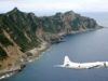 A Japanese government aircraft flies over the Senkaku Islands (Photo: Kyodo News)