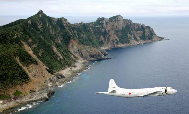 A Japanese government aircraft flies over the Senkaku Islands (Photo: Kyodo News)