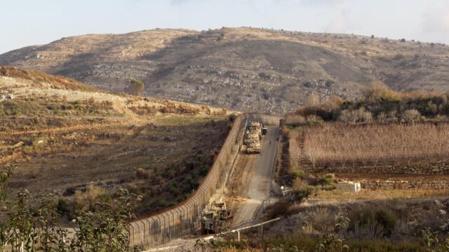 GOLAN HEIGHTS, ISRAEL- DECEMBER 8: Israeli tanks take position on the border with Syria in the Israel-annexed Golan Heights on December 8, 2024 in Golan Heights, Israel.