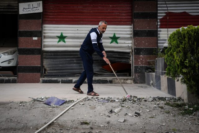 Ashrafiyat Sahnaya, Syria. 01st May, 2025. Abu Farouk, a Syrian real estate agent from Ashrafiyat Sahnaya, in the Rif Dimashq Governorate, clean up debris and damage following deadly clashes between members of the Druze minority and pro-government fighter