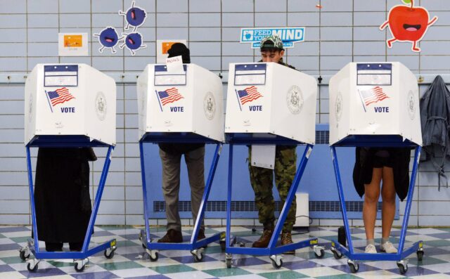 (181106) -- NEW YORK, Nov. 6, 2018 -- Voters fill in their ballots at a polling station in Manhattan of New York, the United States, on Nov. 6, 2018. U.S. voters began to cast their ballots in the midterm elections as the first polling stations opened Tue Voters fill in their ballots at a polling station in New York City.
